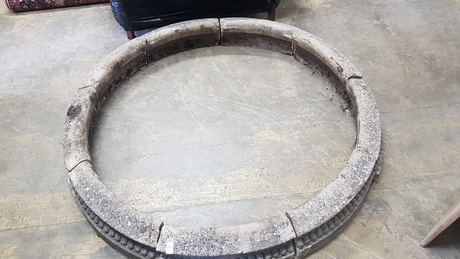 A reconstituted stone circular sectional garden planter, each segment width 68cm, height 28cm